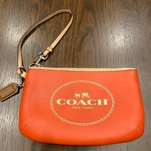 orange coach wristlet